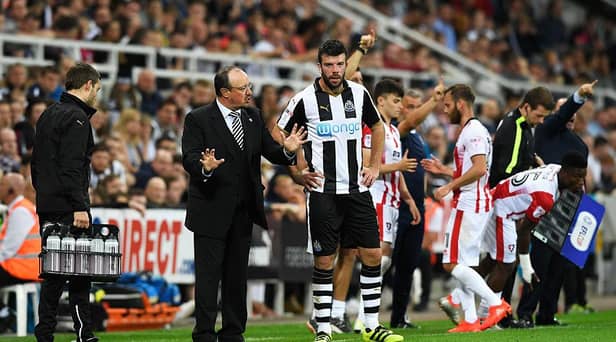 NEWCASTLE UPON TYNE, ENGLAND - AUGUST 23:  Rafael Benitez, Manager of Newcastle United speaks to Grant Hanley of Newcastle United during the EFL Cup second round match between Newcastle United and Cheltenham Town at St. James' Park on August 23, 2016 in Newcastle upon Tyne, England.  (Photo by Stu Forster/Getty Images)
