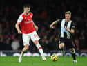 Granit Xhaka of Arsenal passes the ball under pressure from Matt Ritchie of Newcastle.