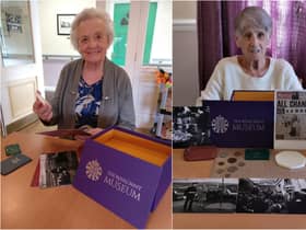 Willowdene Care Home residents Maureen Ingram, 86, (L) and Margaret Frith, 81, looking through the reminiscence box from The Royal Mint Museum.