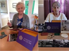 Willowdene Care Home residents Maureen Ingram, 86, (L) and Margaret Frith, 81, looking through the reminiscence box from The Royal Mint Museum.