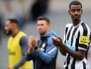 Newcastle United's Swedish striker Alexander Isak (R) applauds the fans following the English Premier League football match between Newcastle United and AFC Bournemouth at St James' Park in Newcastle-upon-Tyne, north east England on September 17, 2022.  (Photo by LINDSEY PARNABY/AFP via Getty Images)