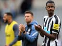 Newcastle United's Swedish striker Alexander Isak (R) applauds the fans following the English Premier League football match between Newcastle United and AFC Bournemouth at St James' Park in Newcastle-upon-Tyne, north east England on September 17, 2022.  (Photo by LINDSEY PARNABY/AFP via Getty Images)