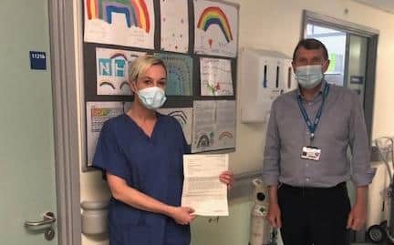 Senior nurse Nicola Peat has been presented with an Excellence Reporting letter by Ken Bremner, South Tyneside and Sunderland NHS Foundation Trust's chief executive.