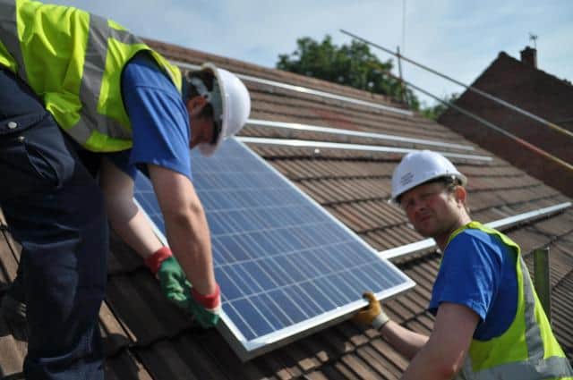 Teams installing solar panels