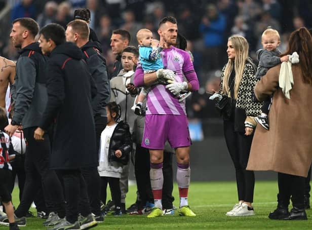 Newcastle United goalkeeper Martin Dubravka and family members of the players on the pitch after the Premier League match against Arsenal in May.