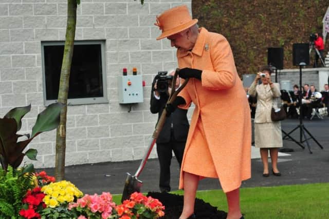 The Queen planting an oak tree at the Tyne Tunnels in South Tyneside, in 2012.
