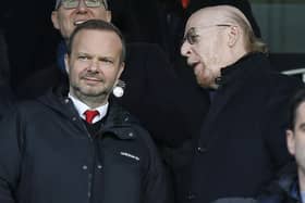 Manchester United's US co-chairman Avram Glazer (R) talks with Manchester United's executive vice-chairman Ed Woodward (L) before the English Premier League football match between Fulham and Manchester United at Craven Cottage in London on February 9, 2019.