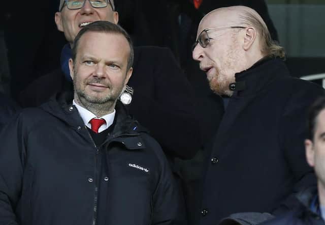 Manchester United's US co-chairman Avram Glazer (R) talks with Manchester United's executive vice-chairman Ed Woodward (L) before the English Premier League football match between Fulham and Manchester United at Craven Cottage in London on February 9, 2019.