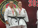 Ellie Smith and Eleisha Mitchinson with their medals.