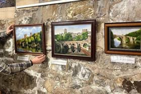 Picture perfect: Deryck Simpson placing his works in The Undercroft cafe at Durham Cathedral.