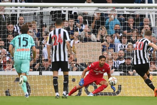 Newcastle United's Chris Wood scores from the penalty spot.