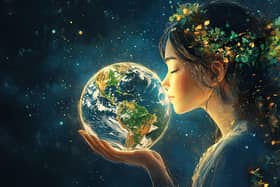 Showing love for Mother Earth (photo: Adobe)