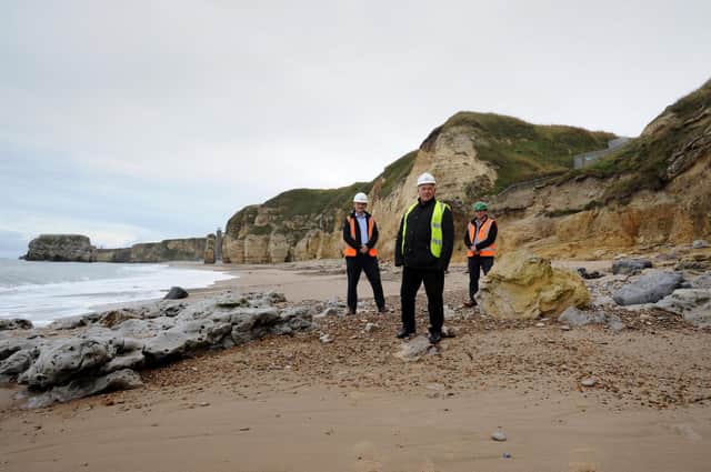South Tyneside Council Cllr Ernest Gibson with ESH Construction contract manager Stephen McClean and project manager Steve Marshall at site of new staircase to access Marsden Beach.