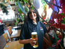 Sinia Jazwi in The New Cyprus Hotel with some of the pub's Christmas decorations.