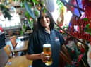 Sinia Jazwi in The New Cyprus Hotel with some of the pub's Christmas decorations.