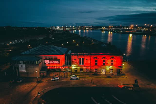 The Customs House was illuminated red last night in solidarity with the live entertainment industry. Photo credit: JORDAN EMBLETON/PHOTOBYJORDAN