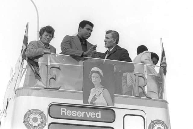 Muhammad Ali abroad the newly-restored bus