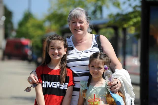 Linda Davison with grandchildren Ruby, seven, and Ellie, eight, thinks restrictions should remain in place a bit longer.