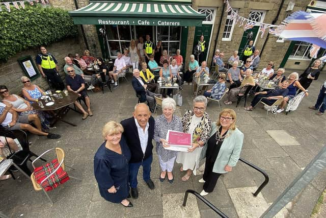 The Mayor of South Tyneside Councillor Pat Hay (2nd right) presents a gift to Fran and Peter Hooper from the Village Cafe, Whitburn to mark their 50th year in business. As The Mayoress Mrs Jean Copp (right) and the Leader of South Tyneside Council Councillor Tracey Dixon look on. Also photographed are members of the public who called at the cafe to congratulate Fran and Peter. Picture by FRANK REID