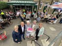 The Mayor of South Tyneside Councillor Pat Hay (2nd right) presents a gift to Fran and Peter Hooper from the Village Cafe, Whitburn to mark their 50th year in business. As The Mayoress Mrs Jean Copp (right) and the Leader of South Tyneside Council Councillor Tracey Dixon look on. Also photographed are members of the public who called at the cafe to congratulate Fran and Peter. Picture by FRANK REID