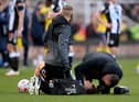 Ryan Fraser is treated after being caught with a high boot.
