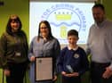 Annalise Allen, assistant head of pupil and staff wellbeing at Westoe Crown Primary School (left) alongside pupil and parents with the award.