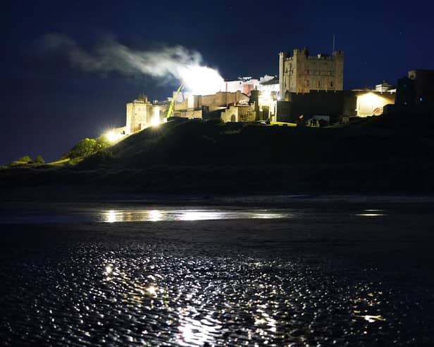 Smoke billows from Bamburgh Castle in Northumberland as filming for the new Indiana Jones 5 movie starring Harrison Ford takes place during the night. Picture date: Thursday June 10, 2021.