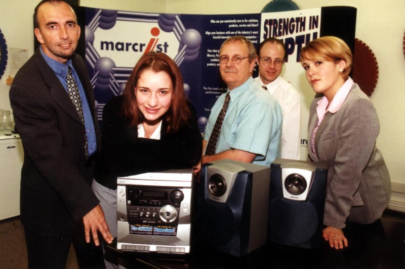 Simon Hughes, Doncaster Skillshop general manager; Laura Greenwood, modern apprentice at Marcrist Industries, receiving the mini hi-fi system; Ian Bannister, Marcrist Industries; Tim Hearn, Marcrist Industries; and Charlotte Fellowes, project manager pictured in 1999