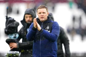 Newcastle United head coach Eddie Howe applauds fans at the London Stadium.