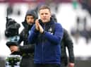 Newcastle United head coach Eddie Howe applauds fans at the London Stadium.