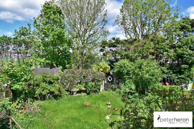 The property has a delightful garden laid mainly to lawn with mature planting.