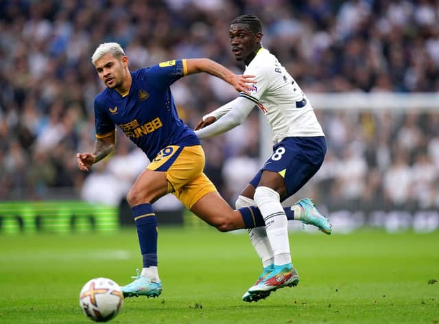 Newcastle United's Bruno Guimaraes and Tottenham Hotspur's Yves Bissouma battle for the ball.