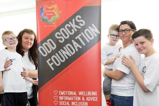 (From left) Odd Socks founders Nichola Winthorpe and son Bobby and Lynsey Baxter with sons Oscar and Harry.
