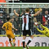 Cambridge United's Bulgarian goalkeeper Dimitar Mitov makes a save during the English FA Cup third round football match between Newcastle United and Cambridge United at St James' Park in Newcastle-upon-Tyne, north east England on January 8, 2022. (Photo by PAUL ELLIS/AFP via Getty Images)