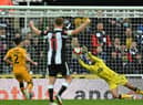 Cambridge United's Bulgarian goalkeeper Dimitar Mitov makes a save during the English FA Cup third round football match between Newcastle United and Cambridge United at St James' Park in Newcastle-upon-Tyne, north east England on January 8, 2022. (Photo by PAUL ELLIS/AFP via Getty Images)