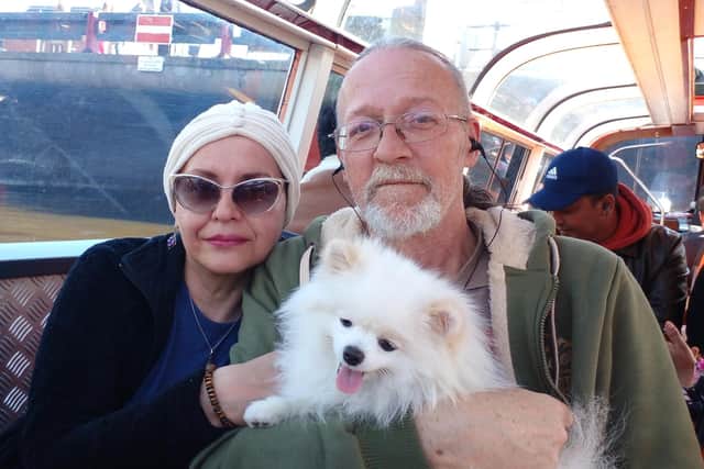 Mike Haley and his wife wife Alla, with their pet Pomeranian, Archie, who kept quarantined in the UK for seven weeks after he fled Kyiv with his family and the dog. Issue date: Thursday May 26, 2022.