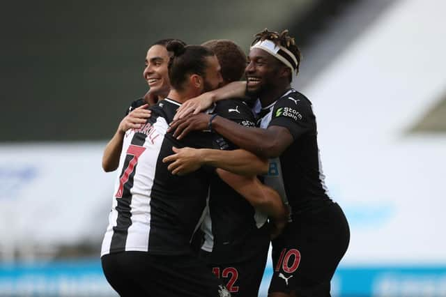 Dwight Gayle of Newcastle United celebrates with his team mates.