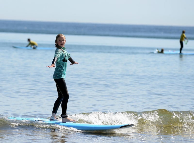 Ten-year-old Honor Gamble tests her skills with South Shields Surf School at Sandhaven Beach. Perfect weather for it!