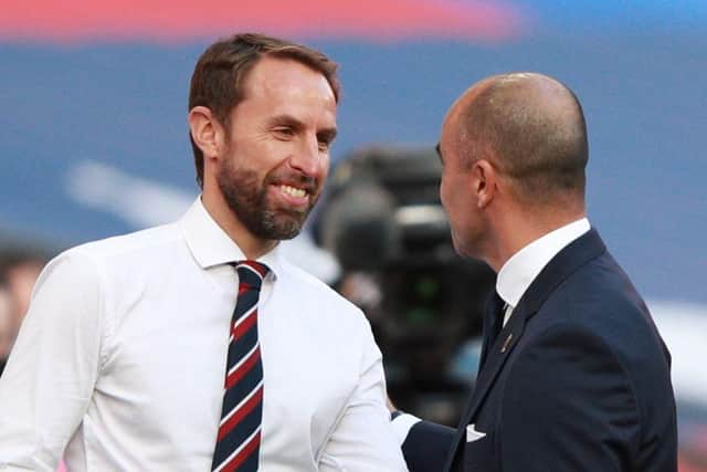 England's manager Gareth Southgate (L) greets Belgium's coach Roberto Martinez before the UEFA Nations League group A2 football match between England and Belgium at Wembley stadium in north London on October 11, 2020. (Photo by Ian Walton / POOL / AFP) / NOT FOR MARKETING OR ADVERTISING USE / RESTRICTED TO EDITORIAL USE (Photo by IAN WALTON/POOL/AFP via Getty Images)