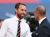 England's manager Gareth Southgate (L) greets Belgium's coach Roberto Martinez before the UEFA Nations League group A2 football match between England and Belgium at Wembley stadium in north London on October 11, 2020. (Photo by Ian Walton / POOL / AFP) / NOT FOR MARKETING OR ADVERTISING USE / RESTRICTED TO EDITORIAL USE (Photo by IAN WALTON/POOL/AFP via Getty Images)