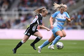 Newcastle United Women's striker Katie Barker runs past Alnwick Town Ladies' defender Kirsty Armstrong during the FA Women's National League Division One North match at St James' Park last year. Photo by Stu Forster/Getty Images