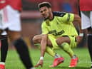 Joelinton in pain at Old Trafford.