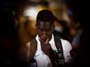 Garang Kuol speaks to reports in Sydney, Australia, in December after returning from the World Cup.