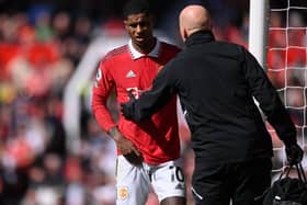 Manchester United striker Marcus Rashford leaves the field with an injury earlier this month.