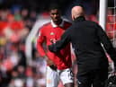 Manchester United striker Marcus Rashford leaves the field with an injury earlier this month.