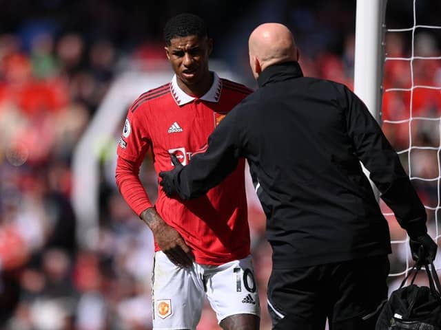 Manchester United striker Marcus Rashford leaves the field with an injury earlier this month.