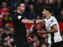 Fulham striker Aleksandar Mitrovic argues with referee Chris Kavanagh at Old Trafford.