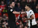Fulham striker Aleksandar Mitrovic argues with referee Chris Kavanagh at Old Trafford.