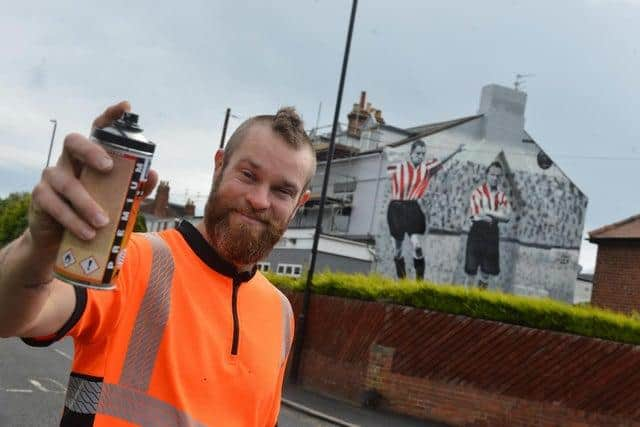 Frank Styles with his mural of top SAFC goalscorer Bobby Gurney on the side of the Golden Fleece pub in Silksworth, Sunderland.