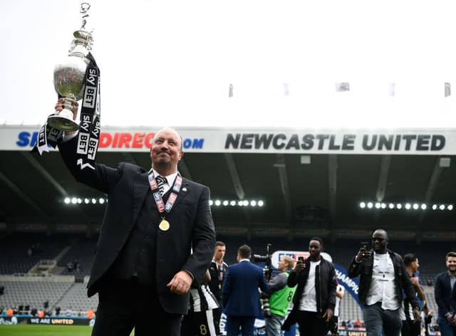 Rafa Benitez with the Championship trophy.